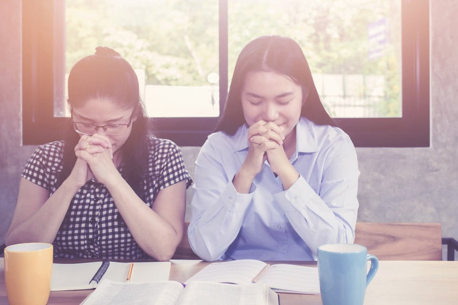 People in Asia praying 