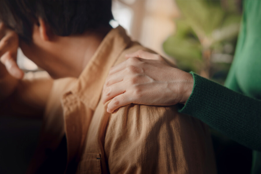 Persons holding hands