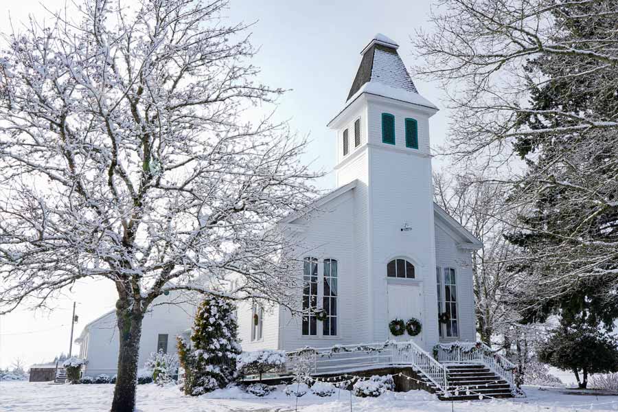 A small Protestant church in the snow in New England